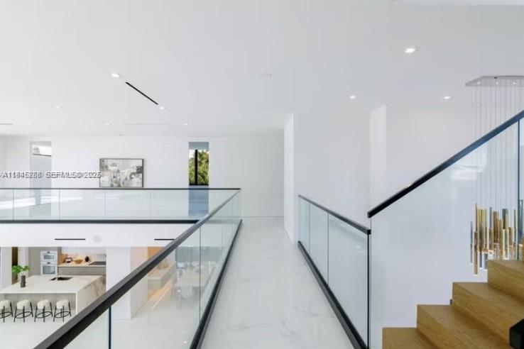 1248 Northeast 89th Street Miami, FL 33138 - Photo 39 of 66 a view of a hallway with furniture and wooden floor