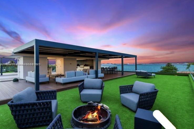 1248 Northeast 89th Street Miami, FL 33138 - Photo 4 of 66 a view of a patio with couches chairs and a yard