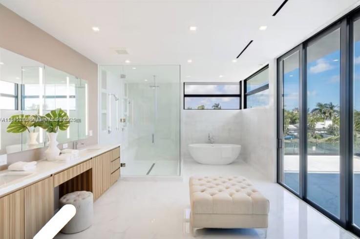 1248 Northeast 89th Street Miami, FL 33138 - Photo 43 of 66 a bathroom with a double vanity sink toilet and shower