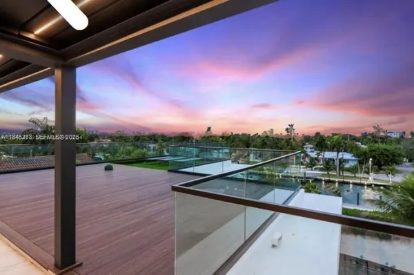 a view of a house with entertaining space and outdoor seating