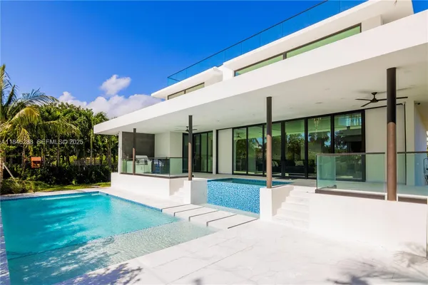 a view of a patio with a table and chairs