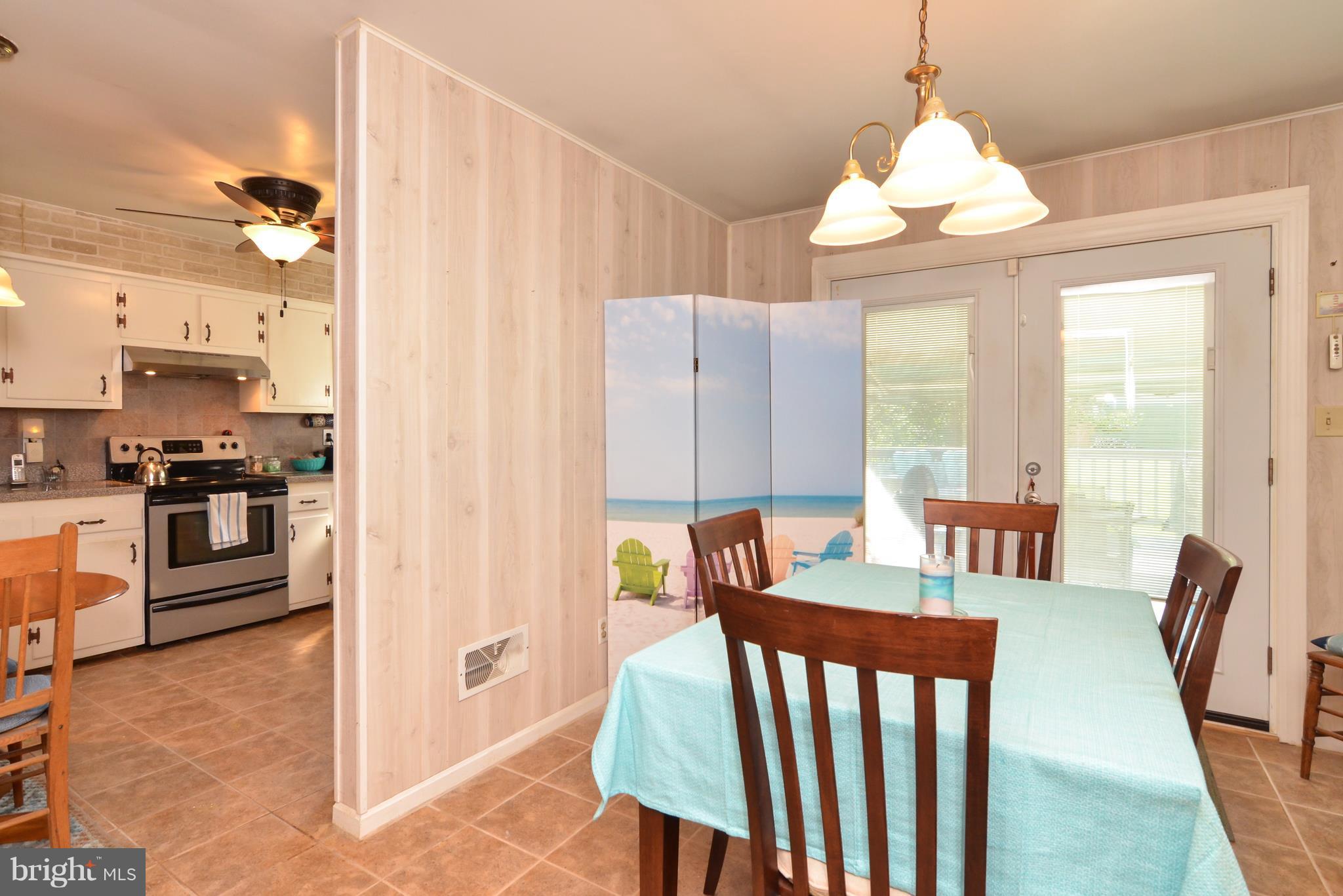 293 Chrystal Road Colonial Beach, VA 22443 - Photo 9 of 26 Dining Room with Doors to Back Deck