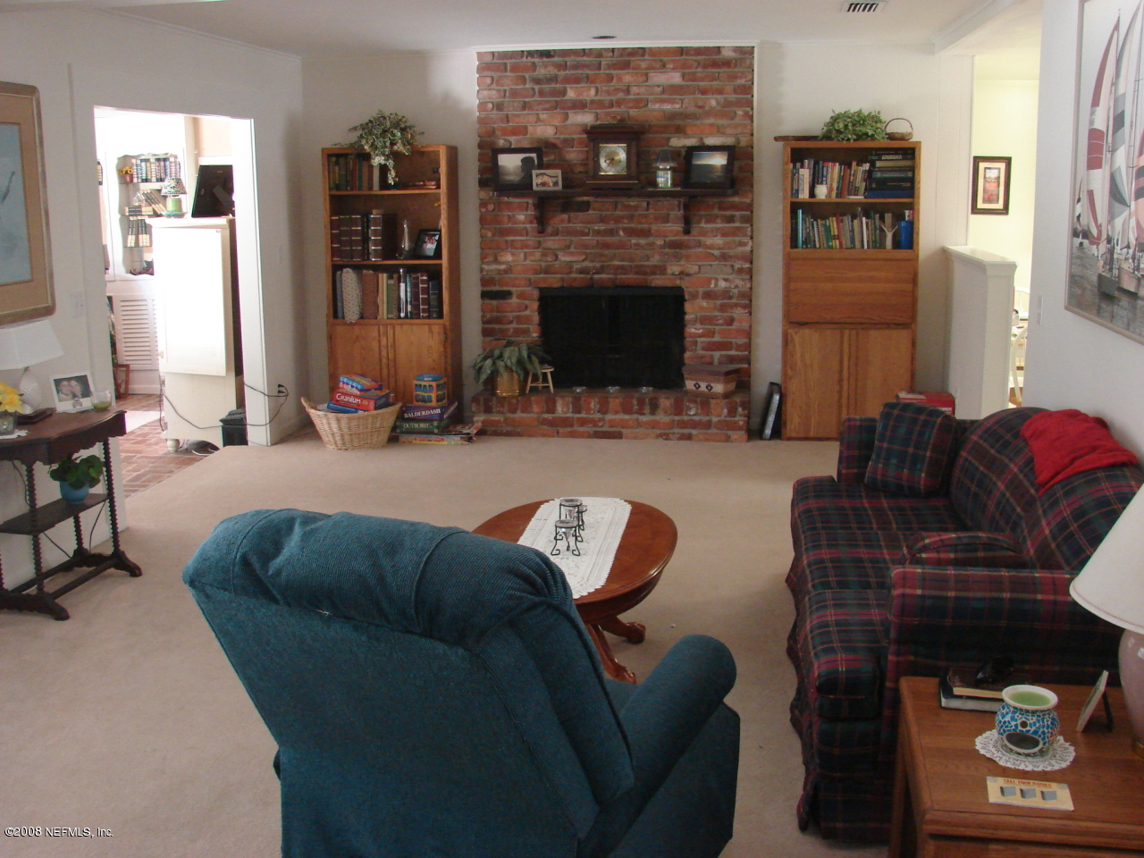 7843 Holiday Road South Jacksonville, FL 32216 - Photo 3 of 13 a living room with furniture and a fireplace