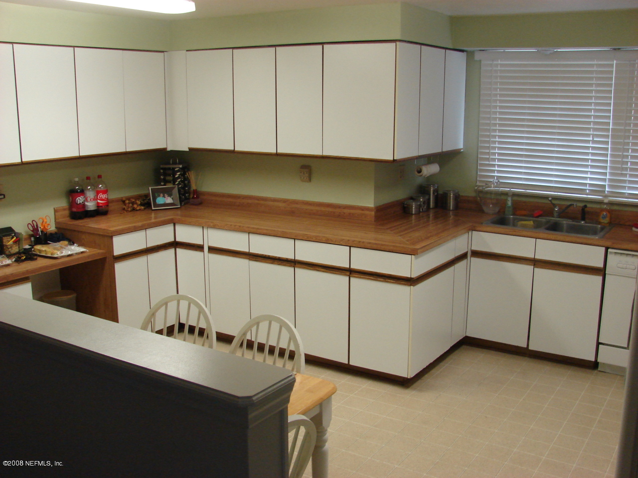 7843 Holiday Road South Jacksonville, FL 32216 - Photo 5 of 13 a kitchen with a cabinets and sink