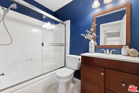 a bedroom with a bed and a table