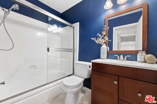 a bedroom with a bed and a table