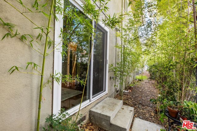 a view of a house with swimming pool and sitting area
