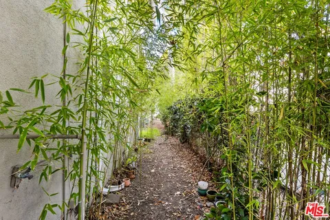 a view of a house with swimming pool and sitting area