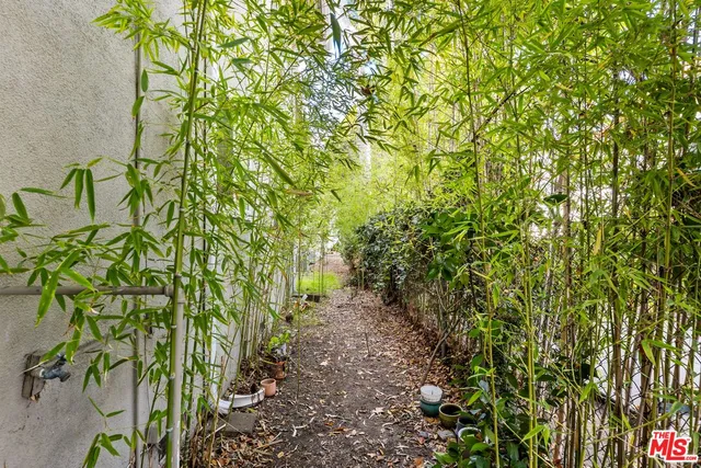 a view of a house with swimming pool and sitting area