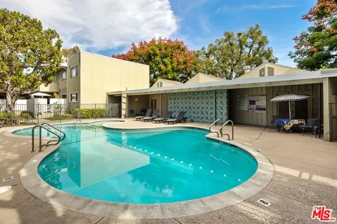 a view of yard with swimming pool