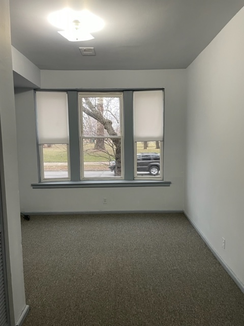 1237 West Marquette Road, Unit 1W Chicago, IL 60636 - Photo 5 of 9 an empty room with a window