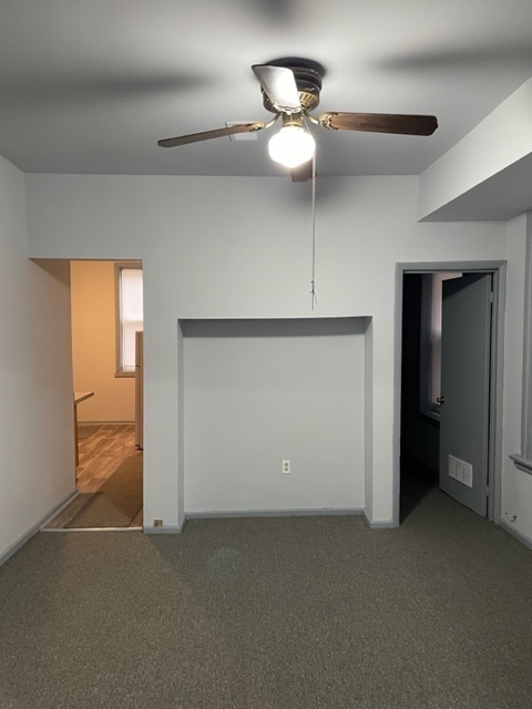 1237 West Marquette Road, Unit 1W Chicago, IL 60636 - Photo 6 of 9 wooden floor in an empty room