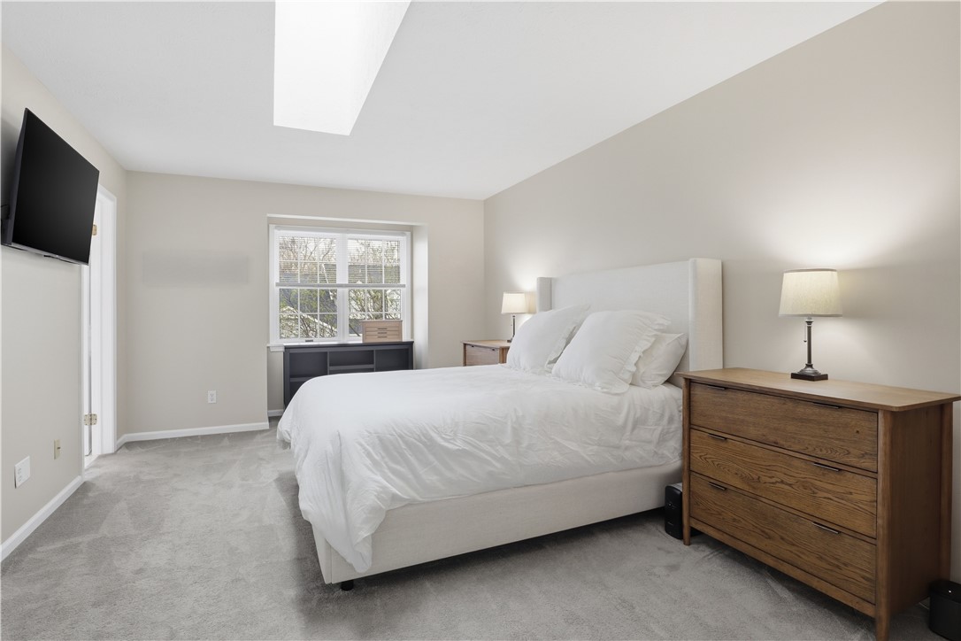 56 Cove Road Canandaigua City, NY 14424 - Photo 20 of 47 Second floor primary bedroom with a skylight.