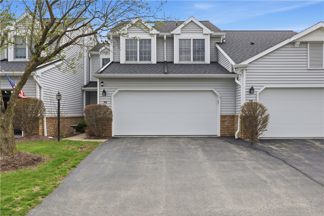 56 Cove Road Canandaigua City, NY 14424 - Photo 2 of 47 2-car attached garage with epoxy floor and an auto