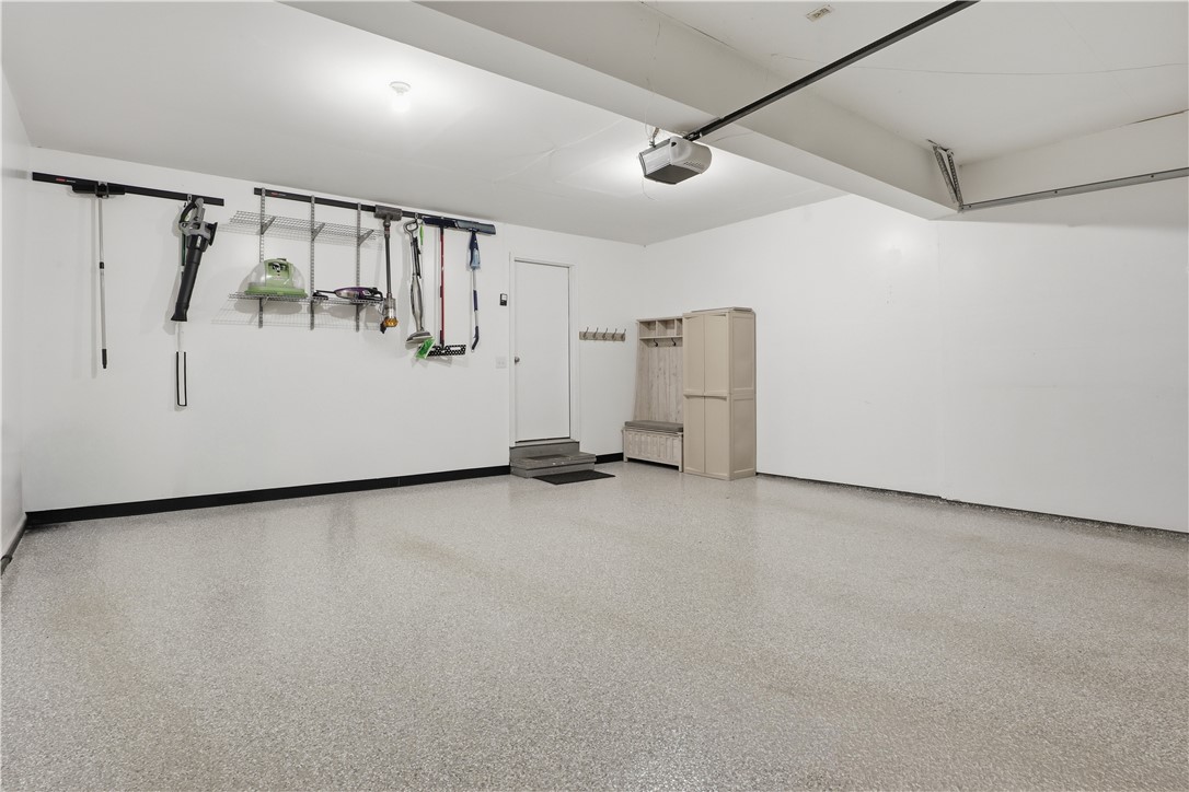 56 Cove Road Canandaigua City, NY 14424 - Photo 30 of 47 2-car attached garage with epoxy floor and an auto