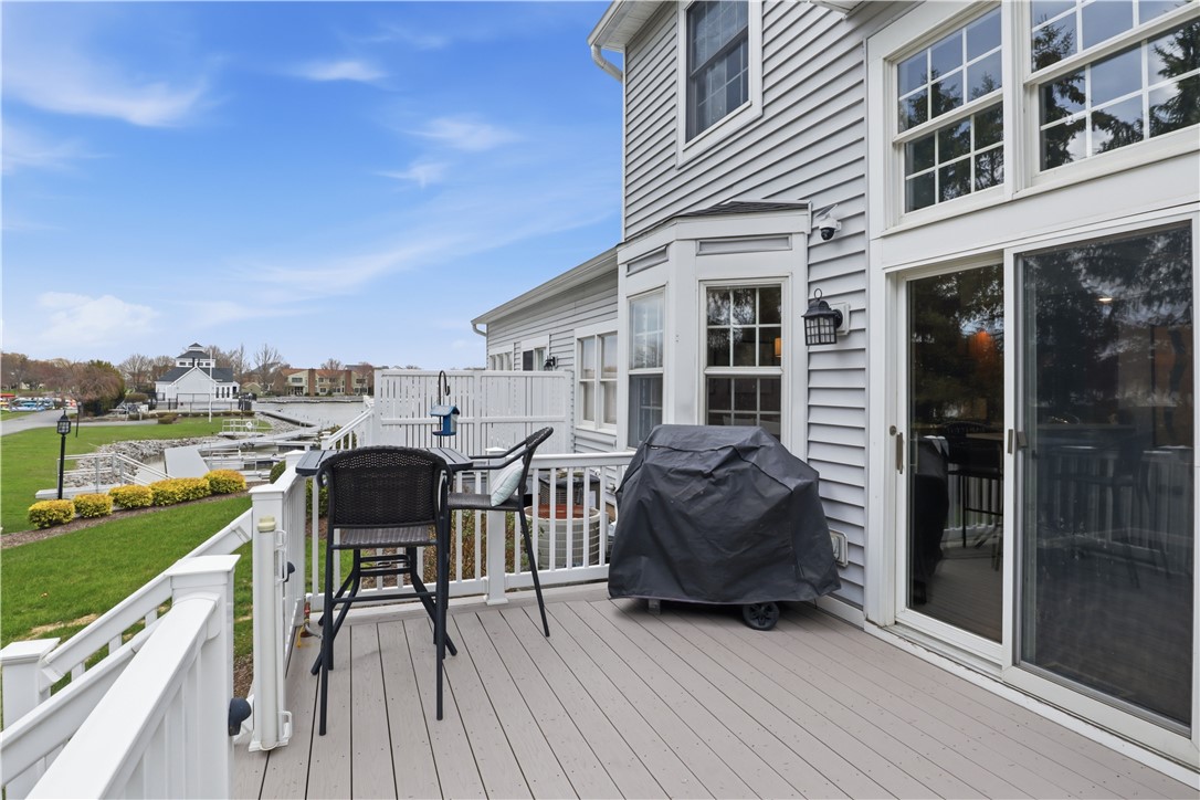 56 Cove Road Canandaigua City, NY 14424 - Photo 34 of 47 Rear deck with clubhouse, pool and channel/water v