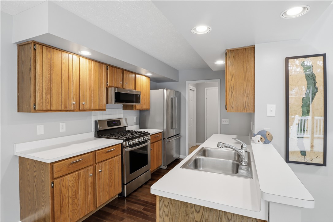 56 Cove Road Canandaigua City, NY 14424 - Photo 10 of 47 Kitchen with Brazilian Harwood flooring and stainl
