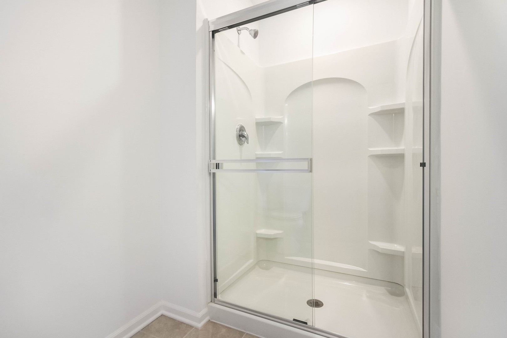 513 Comstock Road South Elgin, IL 60177 - Photo 20 of 30 a bathroom with a glass shower door