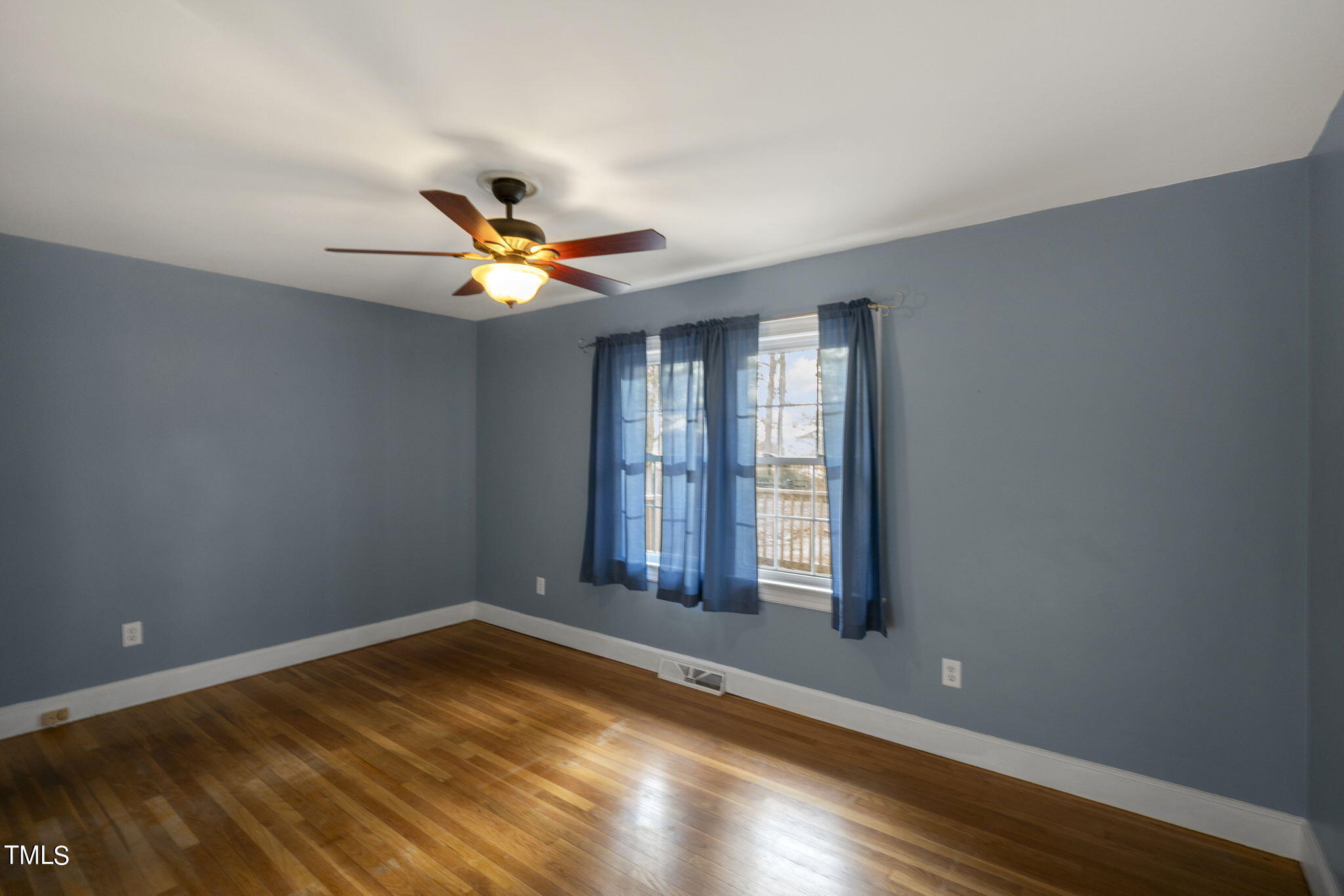 13573 Old Smithfield Road Sims, NC 27880 - Photo 13 of 33 wooden floor in an empty room with a window