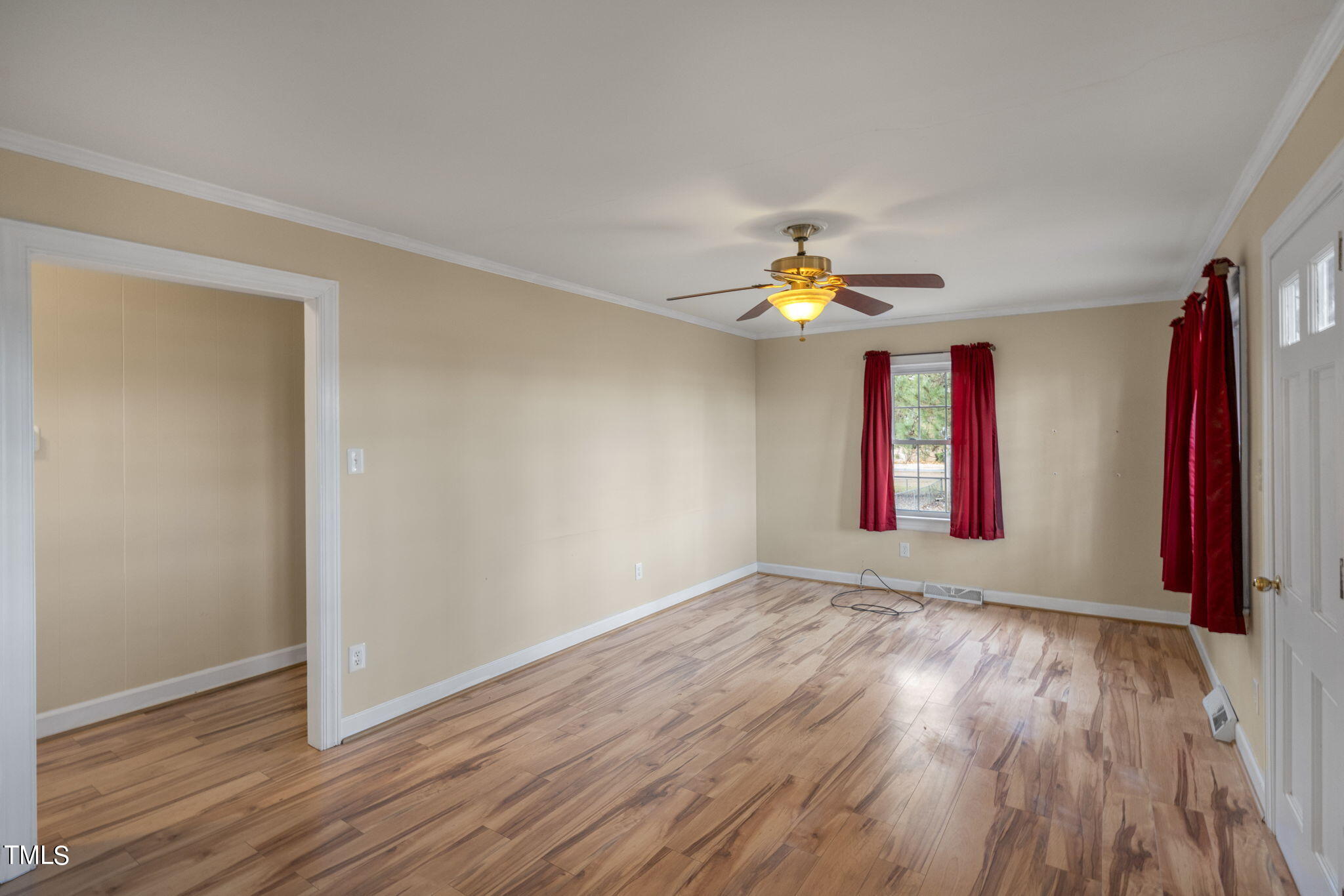 13573 Old Smithfield Road Sims, NC 27880 - Photo 4 of 33 an empty room with wooden floor and window