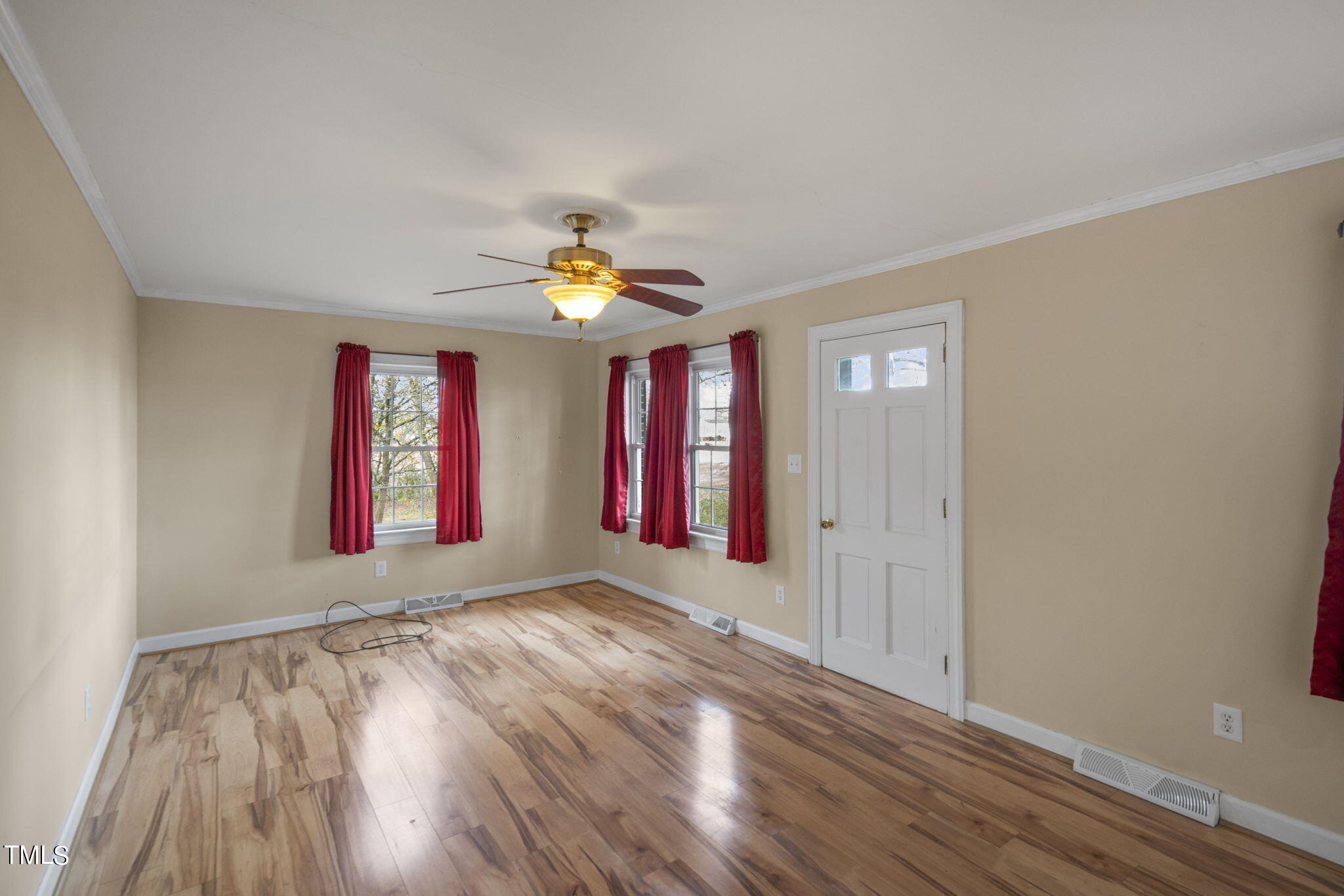 13573 Old Smithfield Road Sims, NC 27880 - Photo 5 of 33 a view of an empty room with window and wooden floor