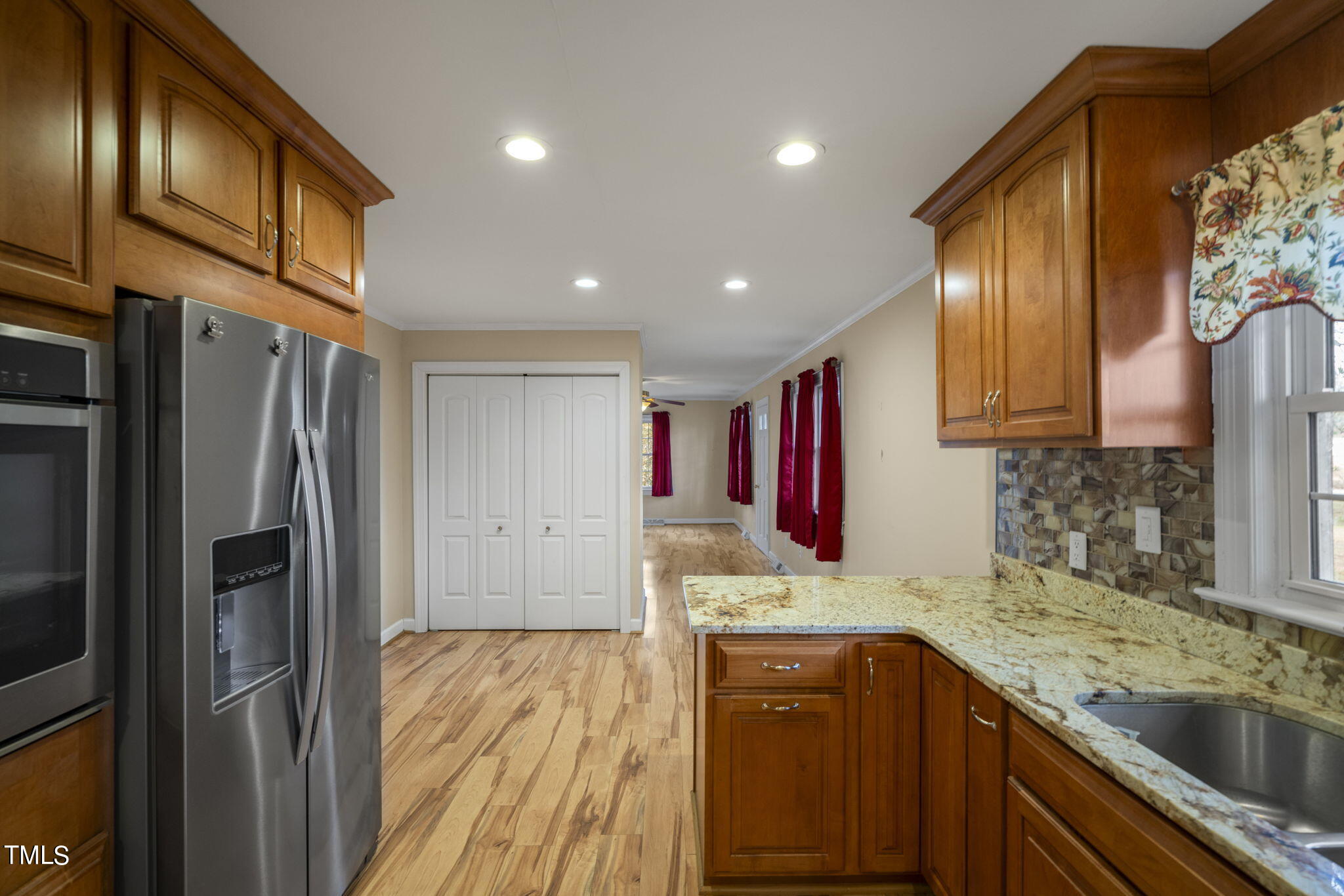 13573 Old Smithfield Road Sims, NC 27880 - Photo 9 of 33 a kitchen with stainless steel appliances granite countertop a refrigerator and a sink