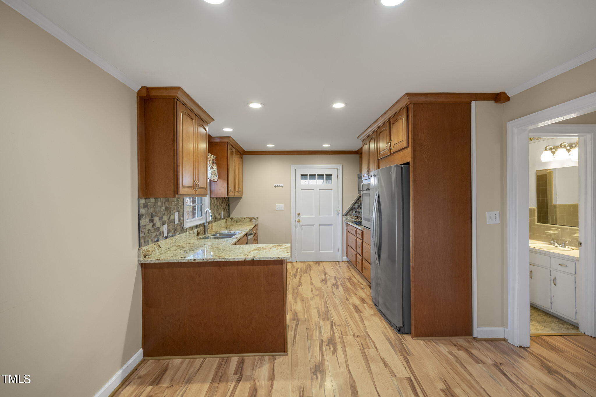 13573 Old Smithfield Road Sims, NC 27880 - Photo 10 of 33 a kitchen with stainless steel appliances granite countertop a refrigerator and a sink