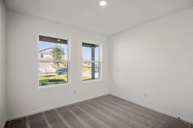 an empty room with windows