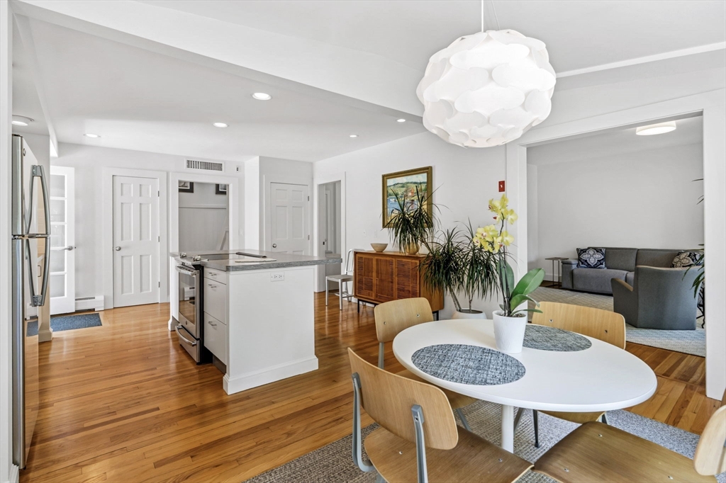 58 Front Street Northampton, MA 01053 - Photo 11 of 42 a view of a dining room with furniture and wooden floor