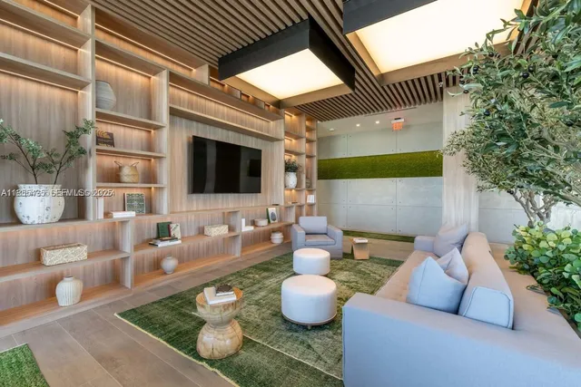 a view of a patio with couches table and chairs and potted plants