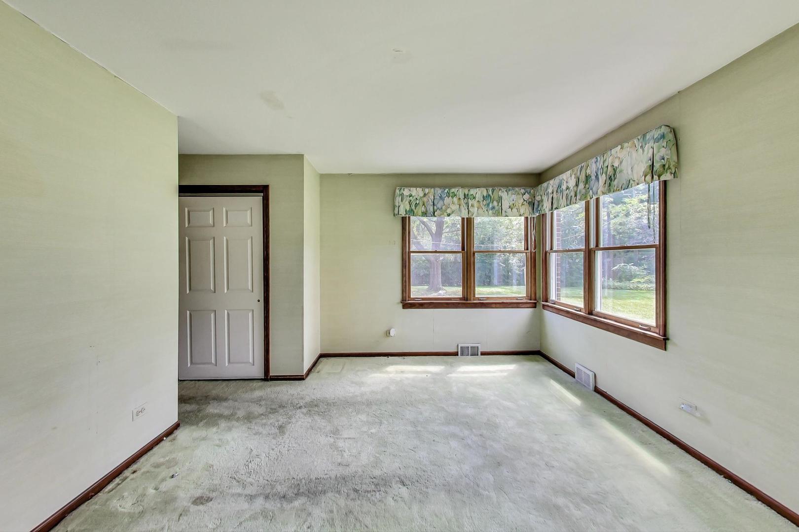 580 North Happ Road Northfield, IL 60093 - Photo 28 of 49 a view of an empty room with a window