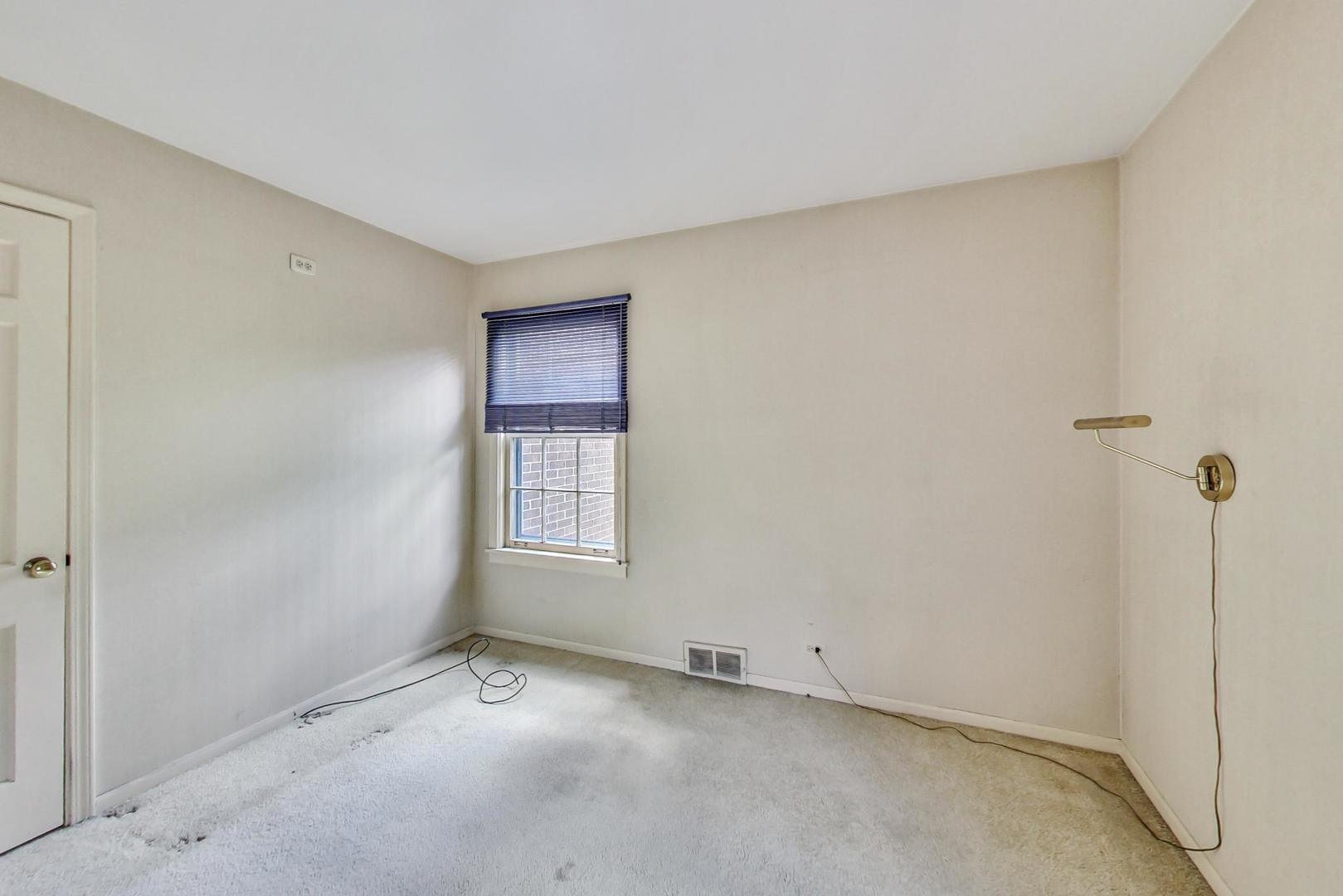 580 North Happ Road Northfield, IL 60093 - Photo 30 of 49 a view of an empty room with a window