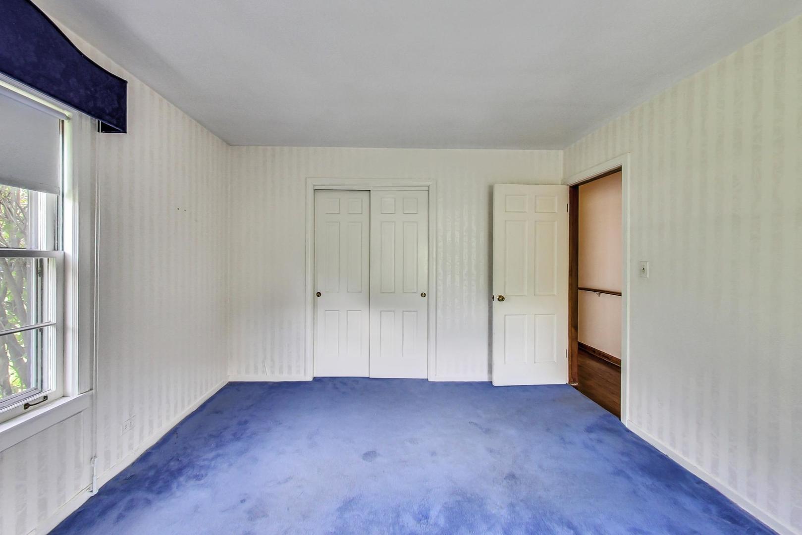 580 North Happ Road Northfield, IL 60093 - Photo 31 of 49 a view of empty room with wooden floor and window
