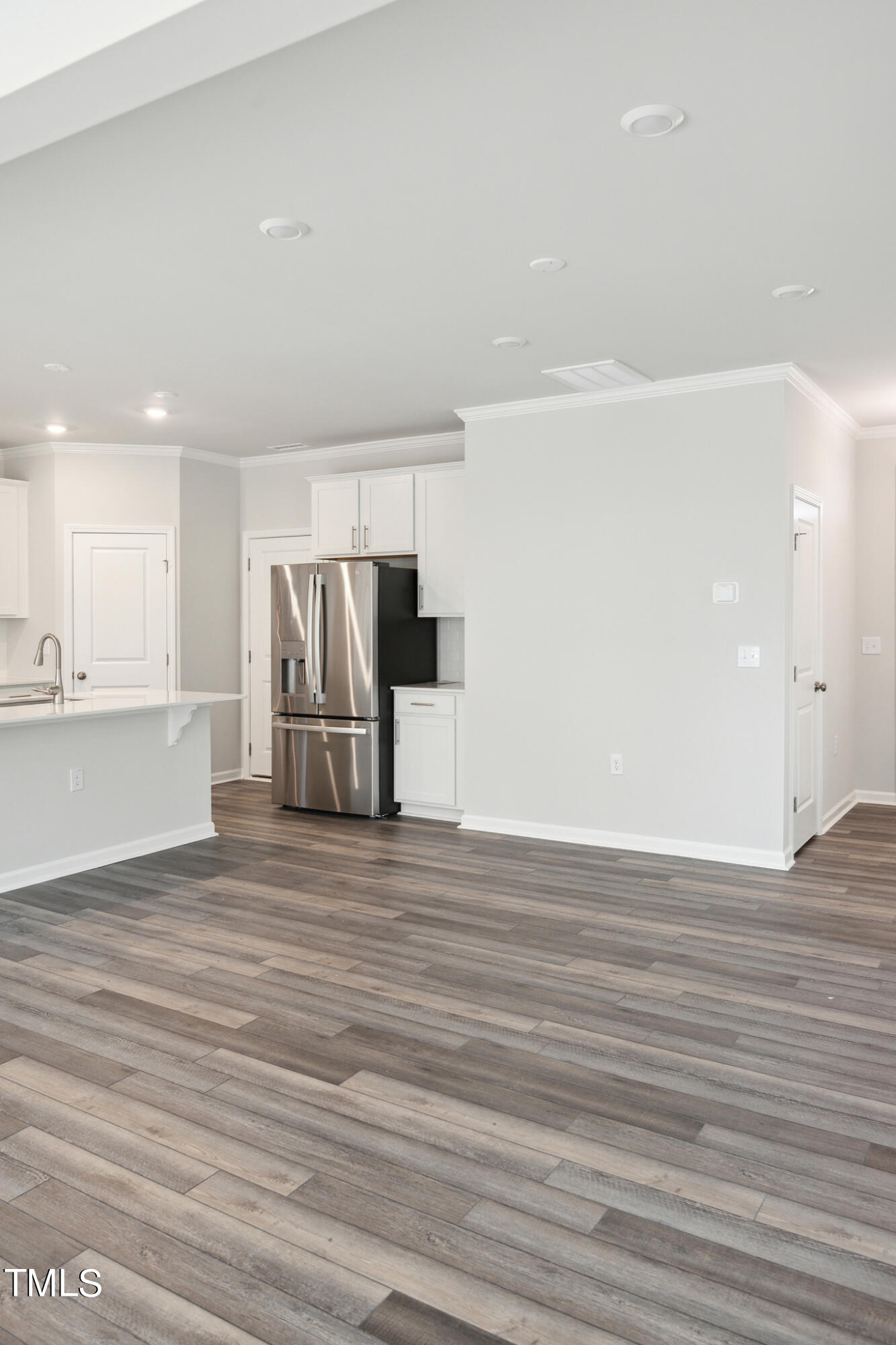 532 Hanover Shore Lane Raleigh, NC 27610 - Photo 12 of 31 a view of empty room with wooden floor