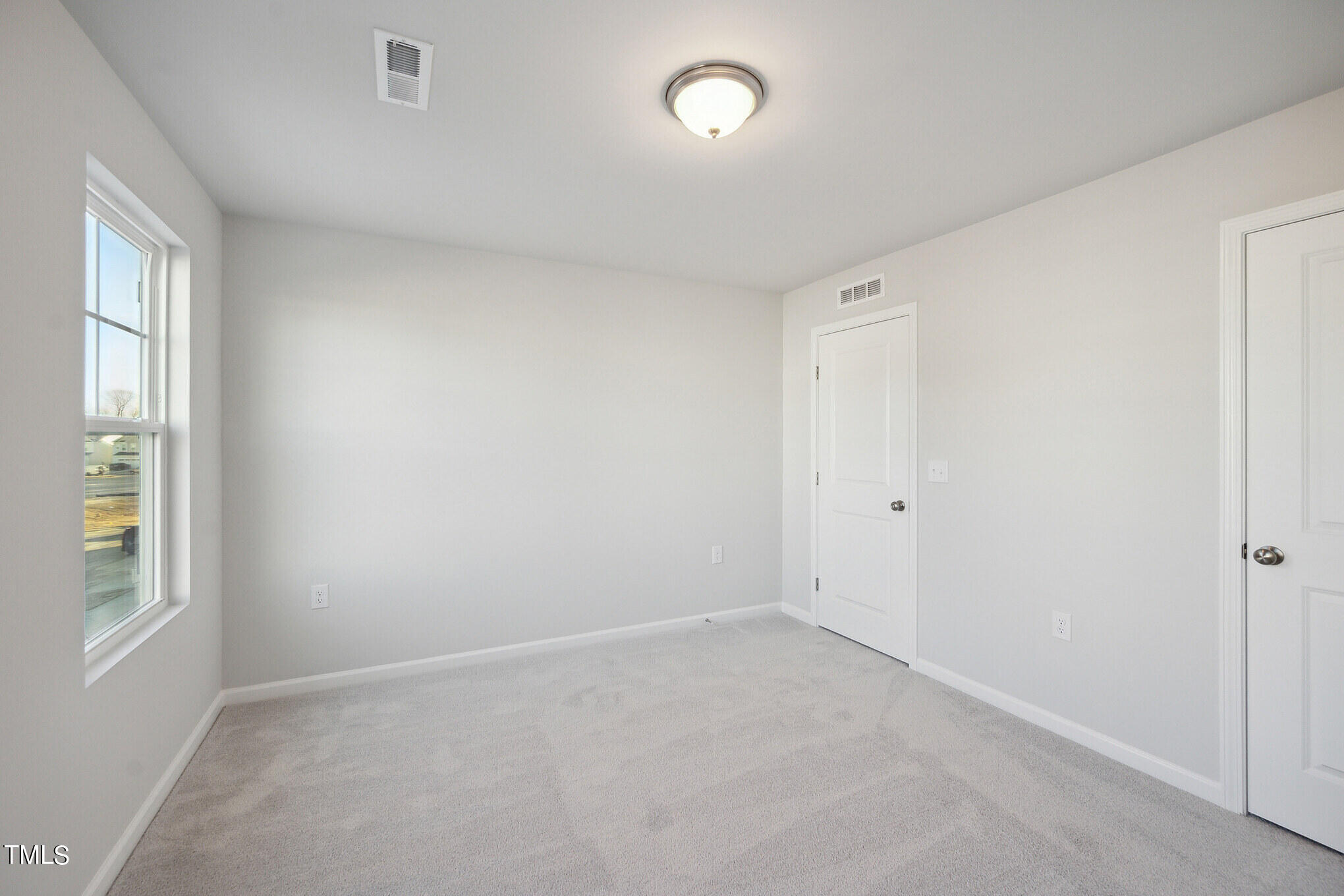 532 Hanover Shore Lane Raleigh, NC 27610 - Photo 17 of 31 an empty room with windows and closet