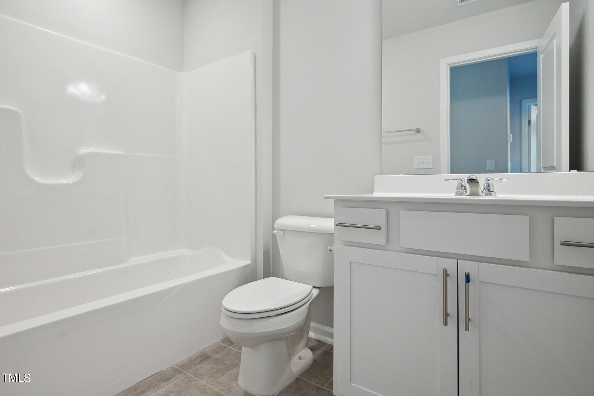 532 Hanover Shore Lane Raleigh, NC 27610 - Photo 19 of 31 a bathroom with a sink a toilet and shower