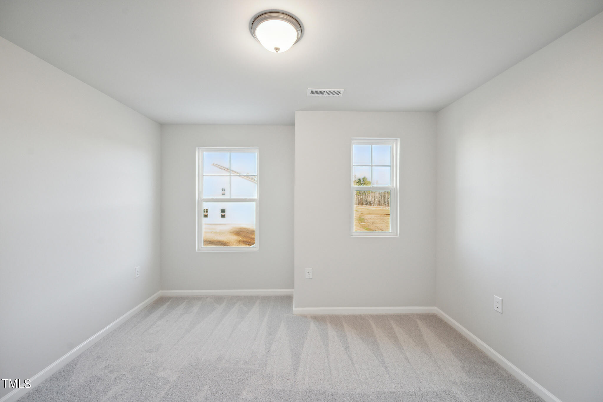 532 Hanover Shore Lane Raleigh, NC 27610 - Photo 20 of 31 an empty room with a window