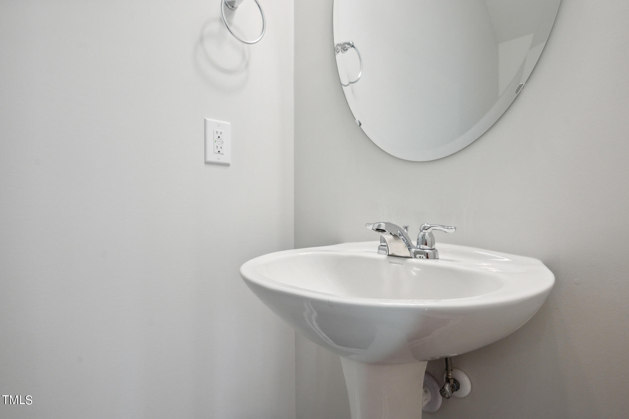 532 Hanover Shore Lane Raleigh, NC 27610 - Photo 25 of 31 a bathroom with a sink and a mirror