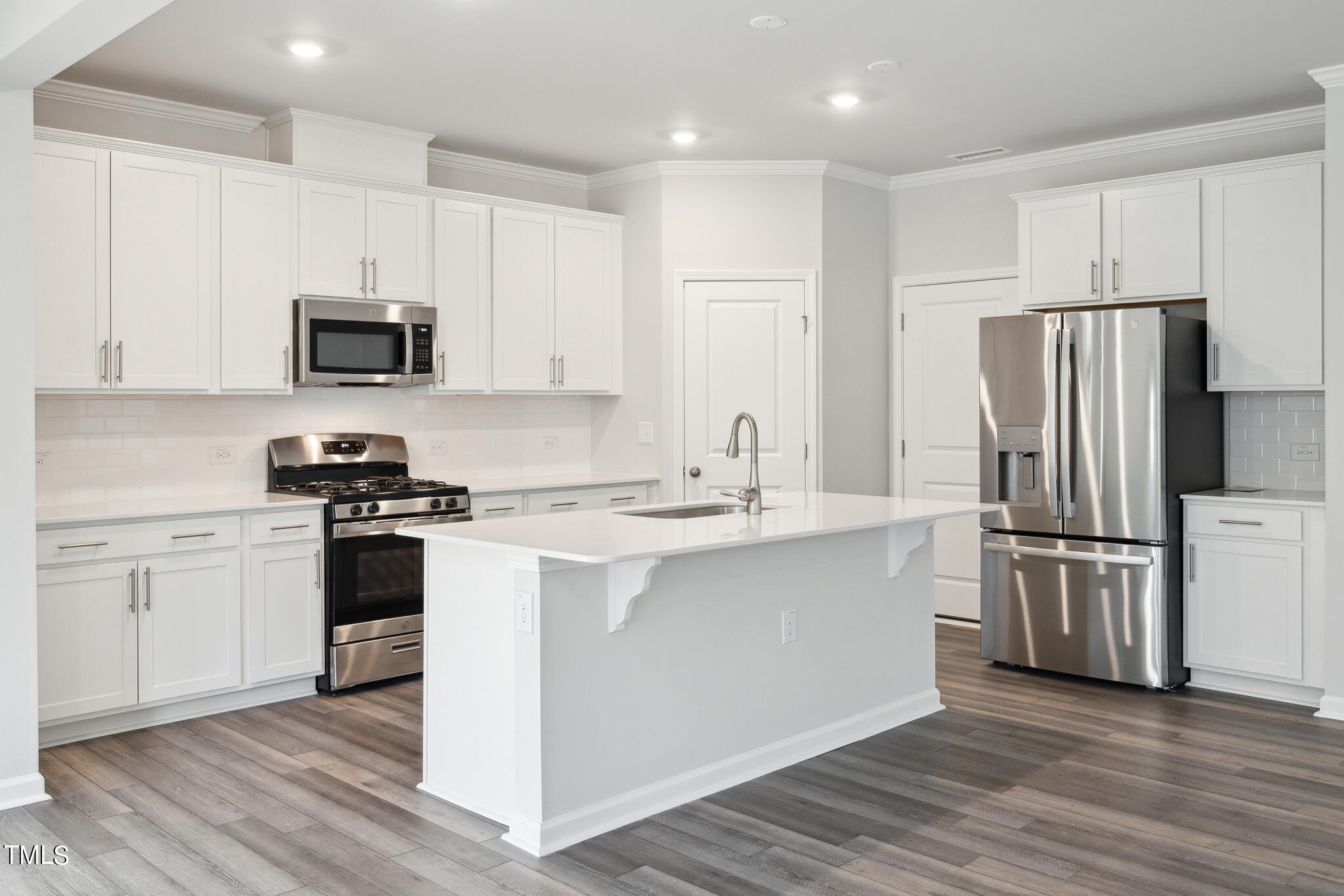 532 Hanover Shore Lane Raleigh, NC 27610 - Photo 10 of 31 a kitchen with cabinets stainless steel appliances and a counter space