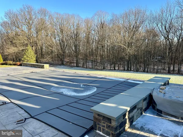 a view of wooden floor with a bench