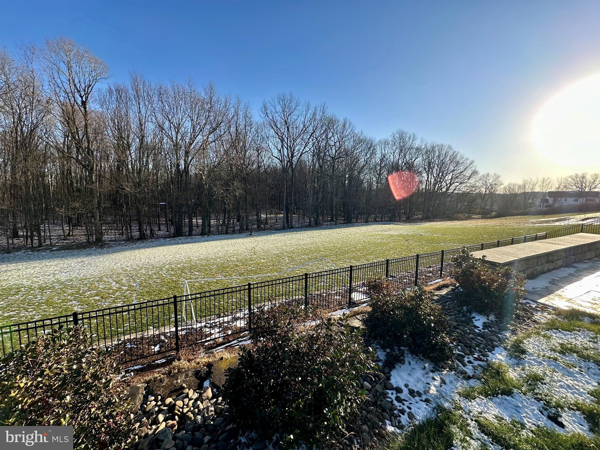 156 Brothers Court Port Matilda, PA 16870 - Photo 18 of 60 Serene winter landscape with sunlit field.
