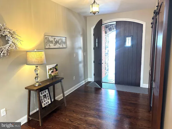a kitchen with stainless steel appliances granite countertop a stove microwave and cabinets