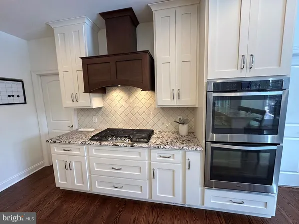 a bed room with a bed window and a dresser