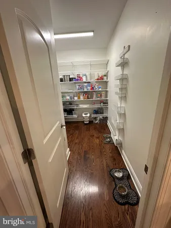 a kitchen with stainless steel appliances granite countertop a sink a stove and a wooden floors