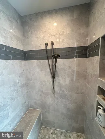 a bed room with two beds and a large window