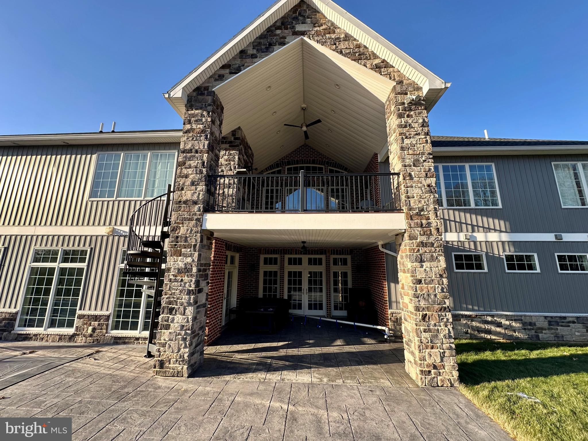 156 Brothers Court Port Matilda, PA 16870 - Photo 8 of 60 Two covered outdoor areas with a fireplace.