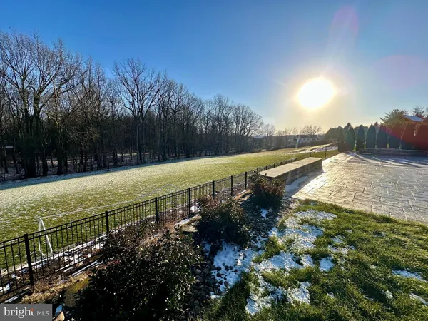a view of a pathway with a yard