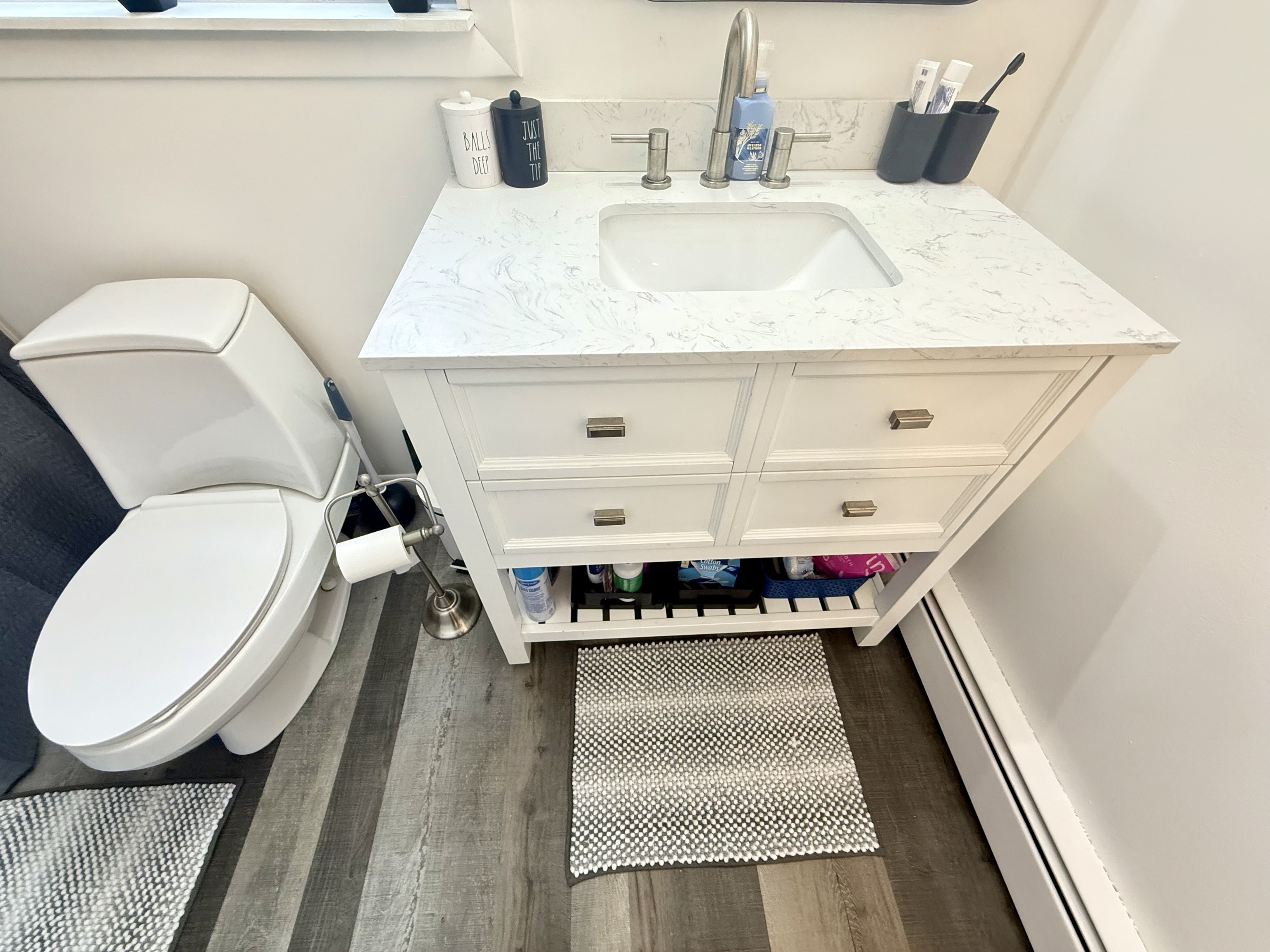 419 Huntington Road Stratford, CT 06614 - Photo 16 of 40 a bathroom with a toilet and a sink