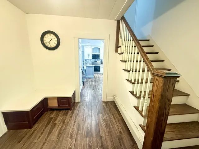 a view of entryway with wooden floor