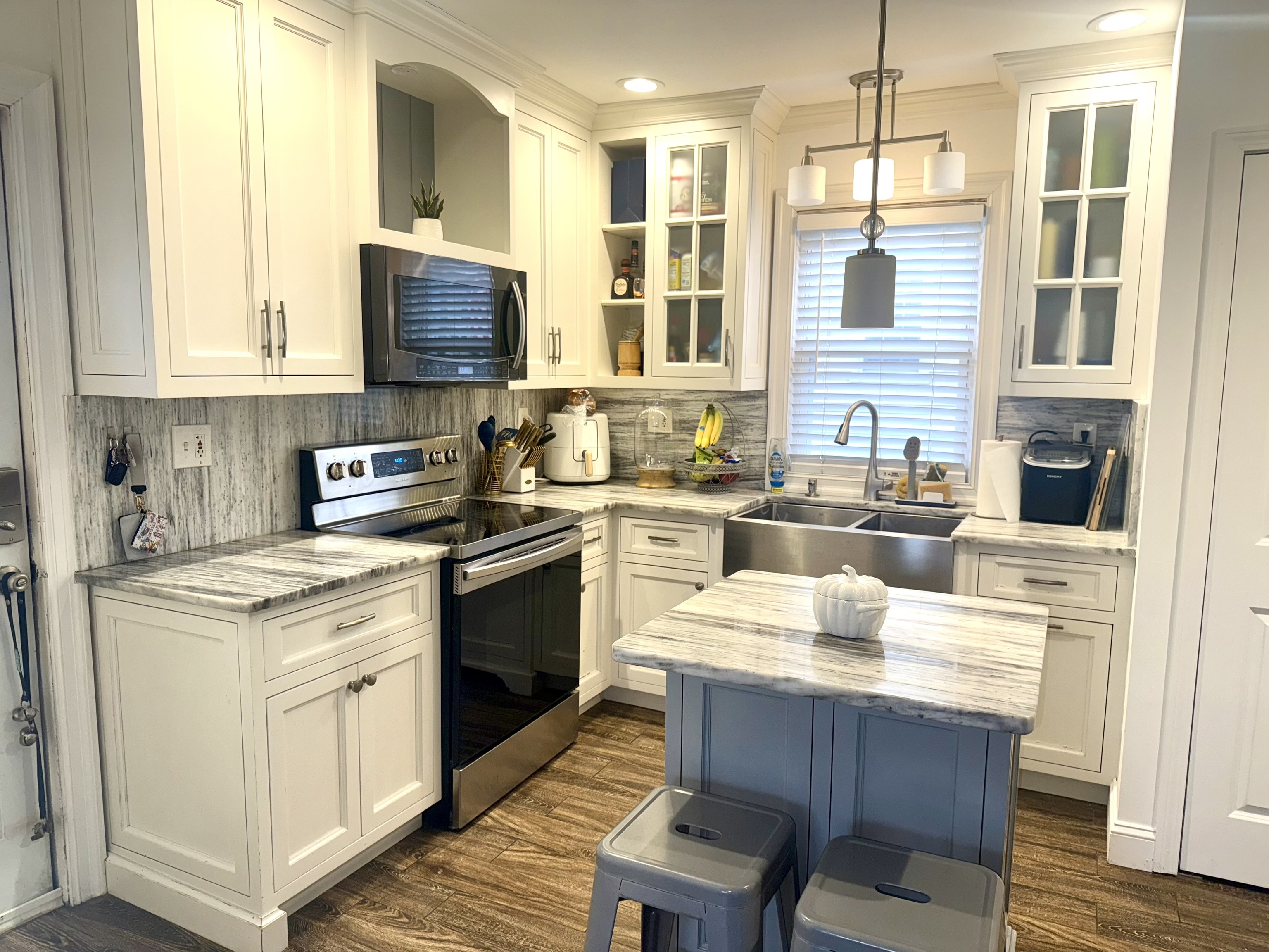 419 Huntington Road Stratford, CT 06614 - Photo 23 of 40 a kitchen with a sink stove and cabinets